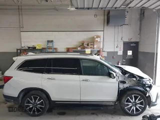 2019 Honda Pilot Elite with VIN 5FNYF6H08KB054725, listed as a IAAI auction lot 40496860 with 91,284 mi miles and . Bid and sale history available at DreamBid. Image 14.