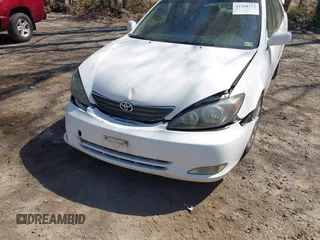 2003 Toyota Camry LE z VIN JTDBF30K930147772, wystawiony jako IAAI lot #41768713 z przebiegiem 231 537 mil mil oraz . Historia ofert i sprzedaży dostępna na DreamBid. Obrazek 6.