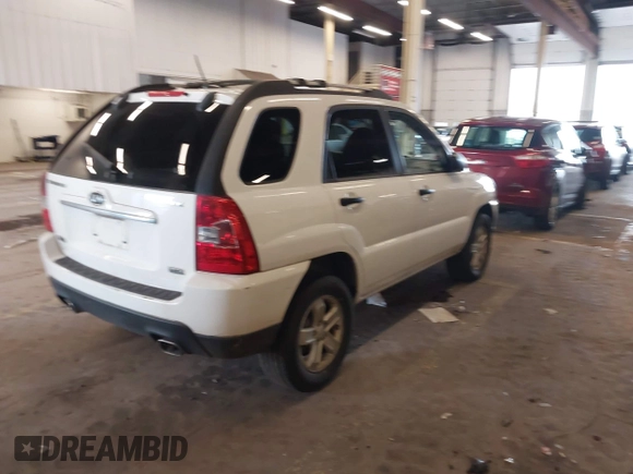 2009 Kia Sportage LX with VIN KNDJE723497563630, listed as a IAAI auction lot 41911423 with 213,040 mi miles. Bid and sale history available at carsss.com. Image 4.