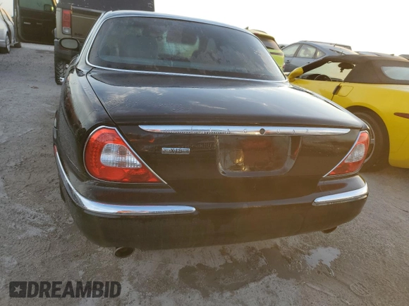 2004 Jaguar XJ with VIN SAJWA71C04SG31354, listed as a Copart auction lot 73742404 with 0 mi miles and Non Repairable. Bid and sale history available at carsss.com. Image 6.