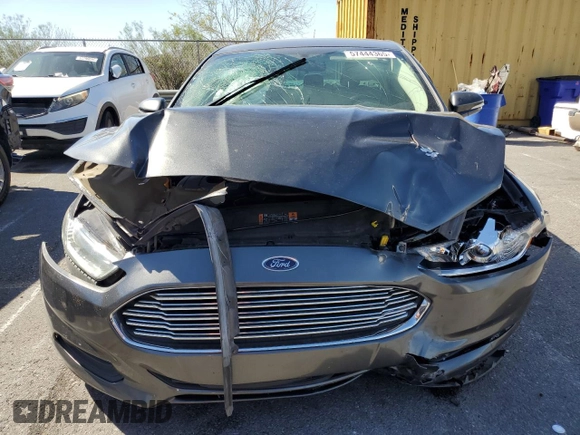 2016 Ford Fusion SE Hybrid with VIN 3FA6P0LU3GR307666, listed as a Copart auction lot 57444365 with 127,786 mi miles and Salvage title. Bid and sale history available at DreamBid. Image 5.