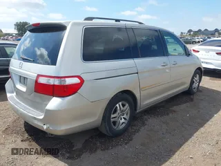 2005 Honda Odyssey EX-L with VIN 5FNRL38655B002926, listed as a IAAI auction lot 42137025 with 209,863 mi miles. Bid and sale history available at carsss.com. Image 4.
