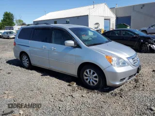 2010 Honda Odyssey EX-L with VIN 5FNRL3H76AB114542, listed as a Copart auction lot 54785425 with 104,239 mi miles and Salvage Title. Bid and sale history available at DreamBid. Image 4.