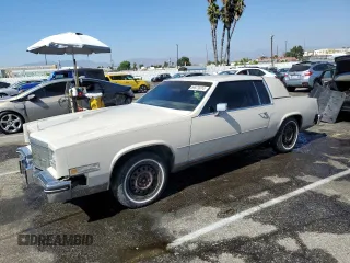 1984 Cadillac Eldorado z VIN 1G6AL5781EE675017, wystawiony jako Copart lot #59573914 z przebiegiem 68 559 mil mil oraz Szkoda całkowita • Salvage title. Historia ofert i sprzedaży dostępna na DreamBid. Obrazek 1.