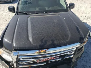 2015 GMC Canyon 2WD SLE with VIN 1GTG5BEA6F1221120, listed as a Copart auction lot 77391484 with 180,334 mi miles and Salvage Title. Bid and sale history available at carsss.com. Image 11.