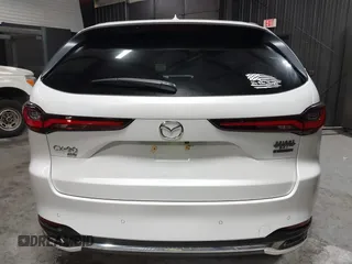 2024 Mazda CX-90 S Premium z VIN JM3KKDHCXR1103272, wystawiony jako IAAI lot #40301969 z przebiegiem 5 235 mil mil oraz . Historia ofert i sprzedaży dostępna na DreamBid. Obrazek 17.