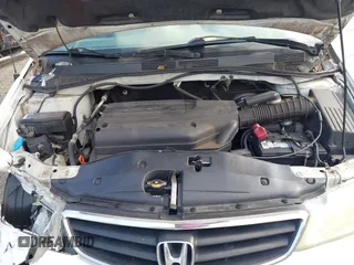 2004 Honda Odyssey EX-L with VIN 5FNRL18924B064040, listed as a IAAI auction lot 41350306 with 130,803 mi miles and . Bid and sale history available at DreamBid. Image 10.