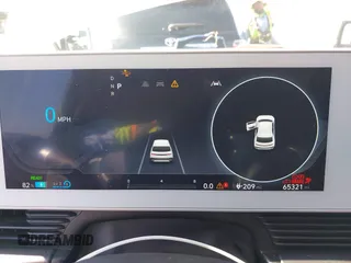 2023 Hyundai Ioniq 5 SE with VIN KM8KMDAF3PU176448, listed as a IAAI auction lot 42218598 with 65,321 mi miles and . Bid and sale history available at DreamBid. Image 7.
