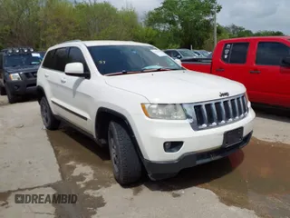 2012 Jeep Grand Cherokee Laredo with VIN 1C4RJFAG8CC124877, listed as a IAAI auction lot 41940603 with 254,356 mi miles. Bid and sale history available at carsss.com. Image 1.