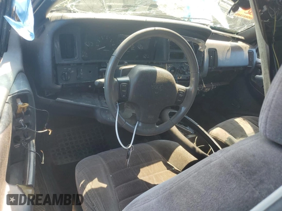 1996 Jeep Grand Cherokee Laredo with VIN 1J4GZ58S9TC277492, listed as a Copart auction lot 66732404 with Not provided miles and Salvage title. Bid and sale history available at DreamBid. Image 8.