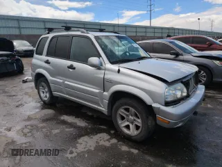 2003 Suzuki Grand Vitara z VIN JS3TD62V434104082, wystawiony jako Copart lot #57349105 z przebiegiem Nie podano mil oraz Szkoda całkowita • Salvage title. Historia ofert i sprzedaży dostępna na DreamBid. Obrazek 4.