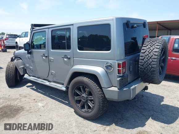 2013 Jeep Wrangler Unlimited Sahara with VIN 1C4BJWEG4DL666930, listed as a IAAI auction lot 42310569 with 206,577 mi miles and . Bid and sale history available at DreamBid. Image 3.