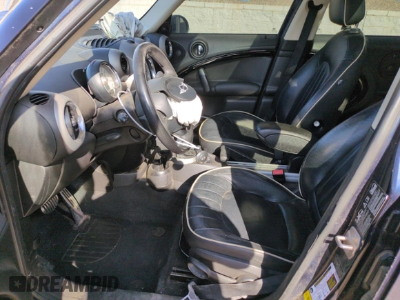 2012 MINI Countryman S with VIN WMWZC5C50CWL63321, listed as a Copart auction lot 52427065 with 126,898 mi miles and Salvage Title. Bid and sale history available at DreamBid. Image 7.