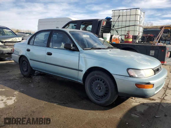 1994 Toyota Corolla Deluxe with VIN JT2AE09B4R0067104, listed as a Copart auction lot 83565064 with 207,923 mi miles and Salvage title. Bid and sale history available at DreamBid. Image 4.