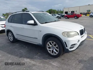 2011 BMW X5 35i with VIN 5UXZV4C54BL412770, listed as a IAAI auction lot 41618946 with 148,612 mi miles. Bid and sale history available at carsss.com. Image 1.