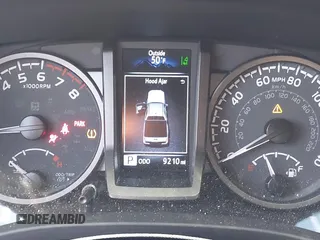 2023 Toyota Tacoma SR with VIN 3TMCZ5AN2PM553928, listed as a IAAI auction lot 40999044 with 9,210 mi miles and . Bid and sale history available at DreamBid. Image 7.