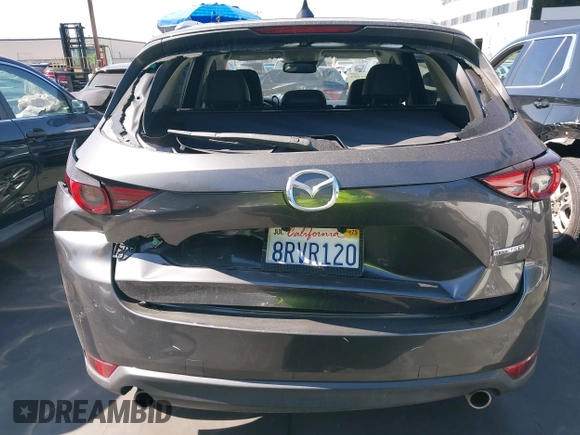 2020 Mazda CX-5 Grand Touring with VIN JM3KFADM3L1812649, listed as a IAAI auction lot 42575393 with 102,118 mi miles and . Bid and sale history available at DreamBid. Image 17.