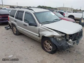 2004 Jeep Grand Cherokee Laredo with VIN 1J4GX48S44C301120, listed as a IAAI auction lot 41281556 with 267,246 mi miles. Bid and sale history available at carsss.com. Image 1.