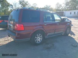 2004 Lincoln Navigator Luxury with VIN 5LMFU27R64LJ13317, listed as a IAAI auction lot 40598909 with 240,131 mi miles. Bid and sale history available at carsss.com. Image 4.