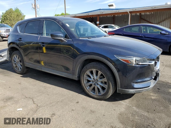 2021 Mazda CX-5 Grand Touring with VIN JM3KFBDM3M1344784, listed as a Copart auction lot 58051445 with 69,593 mi miles and Salvage title. Bid and sale history available at DreamBid. Image 4.