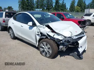 2022 Tesla Model Y Long Range z VIN 7SAYGDEE9NF509655, wystawiony jako IAAI lot #42433796 z przebiegiem 46 936 mil mil oraz . Historia ofert i sprzedaży dostępna na DreamBid. Obrazek 1.