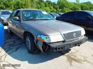 2003 Mercury Grand Marquis GS Convenience with VIN 2MEFM74W43X662724, listed as a IAAI auction lot 42036847 with 234,008 mi miles. Bid and sale history available at carsss.com. Image 1.