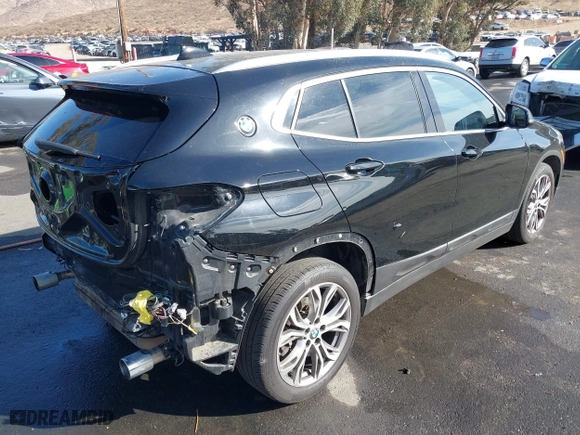 2019 BMW X2 xDrive28i with VIN WBXYJ5C52K5N24828, listed as a IAAI auction lot 41155049 with 59,597 mi miles. Bid and sale history available at carsss.com. Image 4.