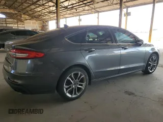 2020 Ford Fusion SEL z VIN 3FA6P0CD3LR131180, wystawiony jako Copart lot #63843355 z przebiegiem 146 705 mil mil oraz Czysty tytuł • Clean title. Historia ofert i sprzedaży dostępna na DreamBid. Obrazek 3.