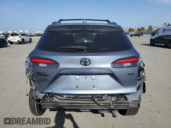 2022 Toyota Corolla Cross XLE с VIN 7MUDAAAG0NV030559, выставлен на аукционе Copart как лот 54075315 с пробегом 28 557 миль миль и Списание • Salvage title. История ставок и продаж доступна на DreamBid. Изображение 6.