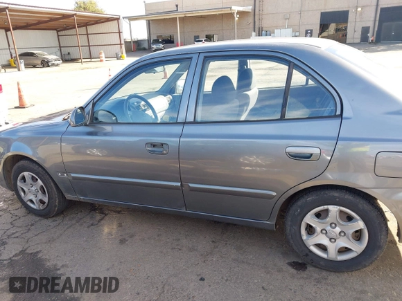 2004 Hyundai Accent GL with VIN KMHCG45C04U531177, listed as a IAAI auction lot 41526033 with 126,102 mi miles. Bid and sale history available at carsss.com. Image 14.