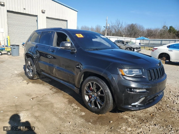 2015 Jeep Grand Cherokee SRT with VIN 1C4RJFDJ1FC663370, listed as a Copart auction lot 86608514 with 123,209 mi miles and Salvage Title. Bid and sale history available at carsss.com. Image 4.