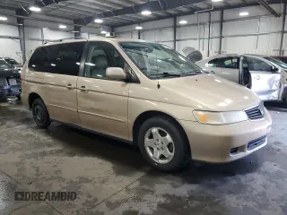 2000 Honda Odyssey EX with VIN 2HKRL1875YH611548, listed as a Copart auction lot 56593275 with 191,533 mi miles and Salvage title. Bid and sale history available at DreamBid. Image 4.