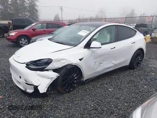 2023 Tesla Model Y Performance z VIN 7SAYGDEF2PF917295, wystawiony jako IAAI lot #41260852 z przebiegiem 23 295 mil mil oraz . Historia ofert i sprzedaży dostępna na DreamBid. Obrazek 2.