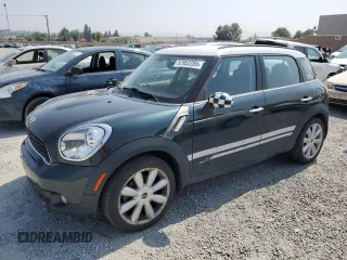 2014 MINI Countryman S with VIN WMWZC5C51EWP39253, listed as a Copart auction lot 57952285 with 95,878 mi miles and Salvage title. Bid and sale history available at DreamBid. Image 1.