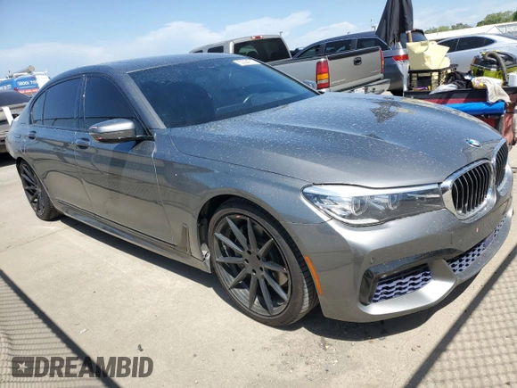 2017 BMW 7 Series 740i with VIN WBA7E2C55HG739108, listed as a Copart auction lot 53304715 with 114,510 mi miles and Salvage title. Bid and sale history available at DreamBid. Image 4.
