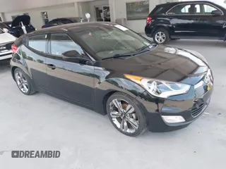 2016 Hyundai Veloster z VIN KMHTC6AD0GU257960, wystawiony jako IAAI lot #42305365 z przebiegiem 115 304 mil mil oraz . Historia ofert i sprzedaży dostępna na DreamBid. Obrazek 1.