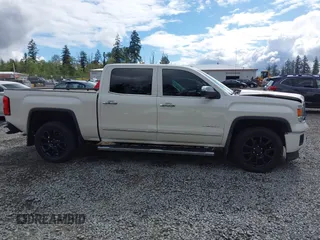 2014 GMC Sierra 1500 Denali z VIN 3GTU2WEJXEG527496, wystawiony jako IAAI lot #42211521 z przebiegiem 151 974 mil mil oraz . Historia ofert i sprzedaży dostępna na DreamBid. Obrazek 13.