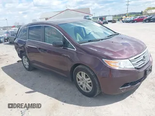 2013 Honda Odyssey LX with VIN 5FNRL5H28DB058401, listed as a IAAI auction lot 42050892 with 221,016 mi miles and . Bid and sale history available at carsss.com. Image 1.