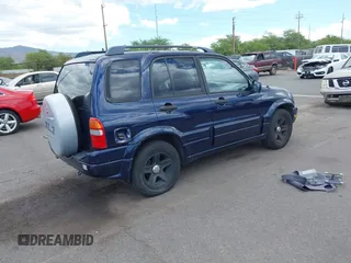 2003 Suzuki Grand Vitara z VIN JS3TE62VX34101877, wystawiony jako IAAI lot #42360315 z przebiegiem 171 207 mil mil oraz . Historia ofert i sprzedaży dostępna na DreamBid. Obrazek 4.