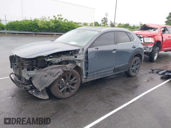2023 Mazda CX-30 S Carbon Edition with VIN 3MVDMBCM9PM574358, listed as a IAAI auction lot 42105931 with 55,975 mi miles and . Bid and sale history available at DreamBid. Image 18.