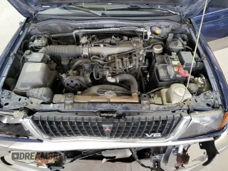 1999 Mitsubishi Montero z VIN JA4MT41R8XP039248, wystawiony jako Copart lot #58486465 z przebiegiem 183 316 mil mil oraz Szkoda całkowita • Salvage title. Historia ofert i sprzedaży dostępna na DreamBid. Obrazek 12.