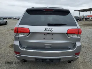 2015 Jeep Grand Cherokee Overland with VIN 1C4RJECG4FC808241, listed as a Copart auction lot 59699685 with 67,542 mi miles and Salvage title. Bid and sale history available at DreamBid. Image 6.