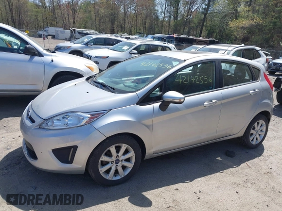 2013 Ford Fiesta SE with VIN 3FADP4EJ3DM136332, listed as a IAAI auction lot 42142556 with 69,979 mi miles and . Bid and sale history available at DreamBid. Image 6.