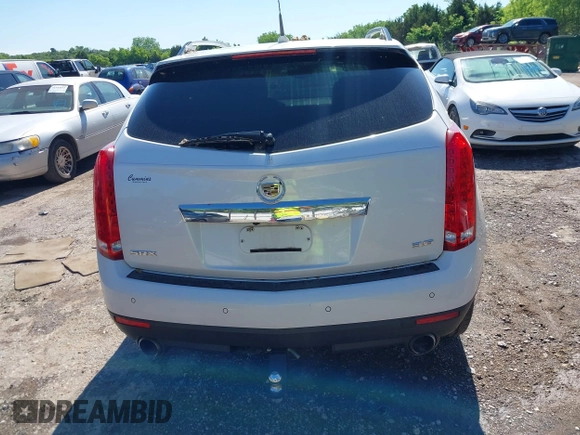 2013 Cadillac SRX Premium Collection with VIN 3GYFNEE33DS554556, listed as a IAAI auction lot 42152972 with 144,668 mi miles and . Bid and sale history available at DreamBid. Image 16.