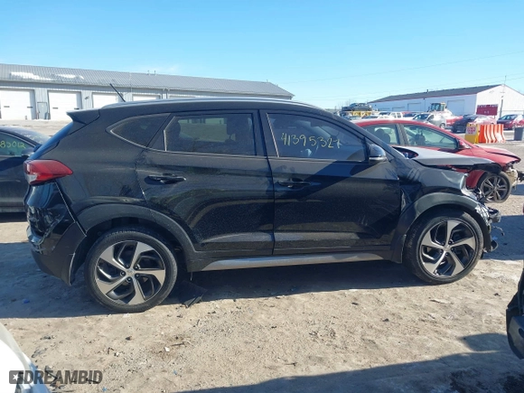 2017 Hyundai Tucson Value with VIN KM8J33A24HU343231, listed as a IAAI auction lot 41395327 with 133,017 mi miles. Bid and sale history available at carsss.com. Image 14.