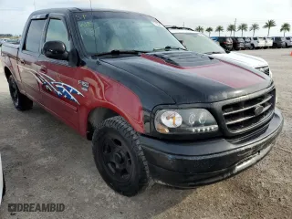 2001 Ford F-150 SuperCrew XLT with VIN 1FTRW07W21KD73871, listed as a Copart auction lot 77952474 with 0 mi miles and Salvage Title. Bid and sale history available at carsss.com. Image 4.