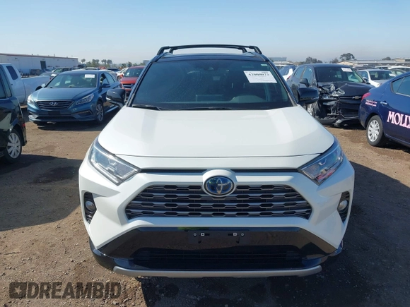 2021 Toyota RAV4 Hybrid XSE with VIN 4T3E6RFV3MU042773, listed as a IAAI auction lot 42000073 with 55,110 mi miles and . Bid and sale history available at DreamBid. Image 13.