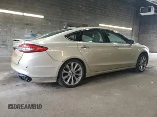 2017 Ford Fusion Titanium z VIN 3FA6P0K96HR132389, wystawiony jako Copart lot #57312665 z przebiegiem Nie podano mil oraz Szkoda całkowita • Salvage title. Historia ofert i sprzedaży dostępna na DreamBid. Obrazek 3.
