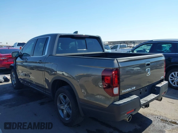 2022 Honda Ridgeline RTL with VIN 5FPYK3F58NB007618, listed as a IAAI auction lot 42258443 with 14,036 mi miles and . Bid and sale history available at DreamBid. Image 3.