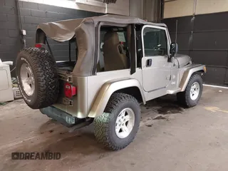 2004 Jeep Wrangler Sahara with VIN 1J4FA59S64P736389, listed as a IAAI auction lot 41432819 with 102,830 mi miles and . Bid and sale history available at DreamBid. Image 4.